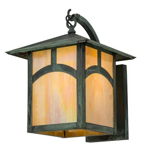 An abstract hilltop design comes to light with this impressive Solid Brass wall sconce, which features a Beige Iridescent art glass diffuser complemented with hardware, frame and decorative accents in a Verdigris finish.This Craftsman Signature lantern, which is perfect for indoor and outdoor lighting applications, is handcrafted by Meyda artisans in our Yorkville, New York manufacturing facility at the foothills of the glorious Adirondack Mountains. Custom styles, colors and sizes are available, as well as dimmable energy efficient lamping options.The fixture is UL and cUL listed for wet and dry locations. Collection: Seneca Finish: Verdi Glass: Beige Iridescent Art Glass Width: 12.00" Height: 16.50" Length: 15.00" Weight: 10.00 lb Extension from Wall: 15.00" Number of Bulbs: 1 Maximum Wattage: 60.00 W Bulb Type: A19 Bulb Base: E26 Material: Steel Country of Origin: USA Safety Listing: Wet Safety Rating: Wet - alternate view