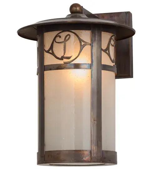 Custom crafted of Solid Copper for interior and exterior lighting applications. This solid mount wall sconce is personalized with the monogram of the client in a Vintage Copper finish that complements the Frosted Seeded Glass shade. The Fulton cylindrical shaped fixture is Domestically Produced in our 180;000 sq ft manufacturing facility in Yorkville; NY. The Build Your Own lighting series offers fully configurable combinations of lantern styles; functions; fixture sizes and metal finishes to meet your lighting needs. UL and cUL listed for dry; damp and wet locations. Personalized items are shown as examples of our craftsmanship. They are not for sale as is but can be customized to fit your personal needs. - alternate view