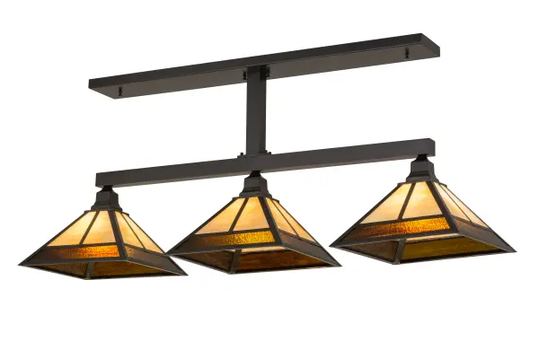 This handsome Craftsman styled Pendant is inspired by the Arts and Crafts movement. 3 Beige Art Glass shades with Root Beer Cathedral Ripple Glass accents feature a striking Mission straight line design. The pendant is enhanced with Solid Brass hardware and decorative accents highlighted in a Craftsman Brown finish. The fixture is ideal for illuminating billiard tables; islands; counters; bars; and tables. The pendant is handcrafted by highly skilled artisans in our 180;000 square foot manufacturing facility. Custom sizes; styles; colors and dimmable energy efficient lamping options are available. The 49-inch long fixture is UL and cUL listed for dry and damp locations.
