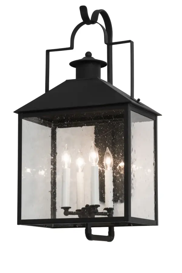 Expert craftsmanship comes to life with a lantern adorned with a candelabra that entices from within.The exquisite Clear Seeded glass lantern, designed with a four-light candelabra featuring four Faux candlelights, is enhanced with a Solid Brass frame and hardware finished in a Black Matte.The wall sconce is custom crafted in the USA. Custom styles, designs, colors and dimmable energy efficient lamping options such as LED are available.This fixture is UL and cUL listed for wet and dry locations. Collection: Vaculin Finish: Matte Black Glass: Clear Seeded Glass Width: 14.00" Height: 25.00" Length: 11.00" Weight: 22.00 lb Extension from Wall: 11.00" Number of Bulbs: 4 Maximum Wattage: 40.00 W Bulb Type: B10 Bulb Base: E12 Material: Steel Country of Origin: USA Safety Listing: Wet Safety Rating: Wet