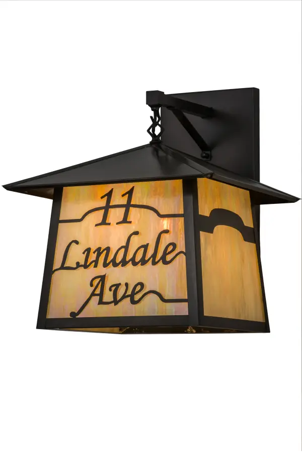 This elegant Craftsman Signature Stillwater wall sconce is personalized with the 11 Lindale Ave address featured in a handsome Craftsman Brown finish. Soft ambient light is diffused beautifully through the Beige Iridescent Glass diffuser. The fixture is perfect for installation on interior walls in corridors and offices. The Personalized Stillwater Wall Sconce is included in our American-made; American-designed; handcrafted Personalized Collection and manufactured in Yorkville; New York. The fixture is UL and cUL listed for dry; damp and wet locations. This lighting fixture can be ordered by calling us and adding your business or family name for your next project. This wall sconce is included in our Build Your Own Craftsman Signature Series; which features unlimited combinations of styles. The collection is called Build Your Own because it is fully configurable and customizable from size and design to finish and lens color. Marine grade; solid brass; or copper raw materials are utilized to ensure items from the Craftsman Signature Series of outdoor and indoor lighting will stand the test of time; as these premium metals are impervious to most types of oxidation. Hand-applied Patina finishes on brass and copper are sealed with a clear varnish and over time; may require gentle maintenance; such as wax; to delay or reverse the natural living finish attributes indicative of this finishing process. Patina finishes on brass and copper provide strong resistance to fading from sun exposure; will not chip or crack; and will not rust like a steel-framed item in the same conditions. Choose from many style options; or send us your concept today! Call today to learn how to use the configuration tool available on our website for an instant item number!