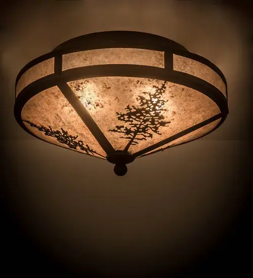Tall Tamarack trees grow tall toward the brilliant rays of a sunlit sky; glowing from stunning Silver Mica. Designed in the Craftsman tradition; this handsome lens is complemented with a frame and decorative accents featured in an Oil Rubbed Bronze finish. Custom crafted by highly skilled artisans in our manufacturing facility at the foothills of the spectacular Adirondack Mountains in the USA; this ceiling fixture is available with dimmable energy efficient lamping options such as LED. Tamarack is also offered in custom designs; colors and sizes. The flushmount is UL and cUL listed for damp and dry locations.
