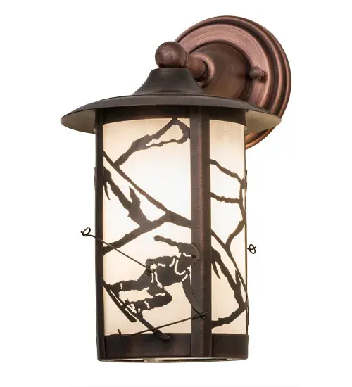 A winter skier slaloming down the slopes is delicately etched of Solid Brass in this compelling design; which features ambient lighting diffused beautifully through White art glass. This compelling Craftsman Signature cylindrical fixture is enhanced by a frame and hardware featured in an Antique Copper finish. The sconce is perfect as a wall fixture in any room or exterior where you want to make a design statement; whether it is located in a lodge; resort; retailer; home or camp. The sconce is handcrafted in the Meyda manufacturing facility at the foothills of the Adirondack Mountains; not far from Lake Placid; home of the 1932 and 1980 Winter Olympics. Custom sizes; styles; colors and dimmable energy efficient lamping options such as LED; are available. This fixture is UL and cUL listed for wet and dry locations. - alternate view