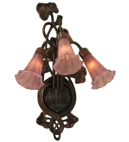 One of the most popular Louis Comfort Tiffany styled lamps on the market today, recreating his famous Favrile design from the early 1900's. This softly mottled Cranberry Red shaded Three Light Wall Sconce offers an attractive, delicate design featuring shades mouth blown of fine art glass. Lily shades are suspended from stems delicately winding above a Lily pads fixture finished by hand in Mahogany Bronze. Collection: Cranberry Pond Lily Finish: Mahogany Bronze Glass: Cranberry Glass Width: 10.50" Height: 17.00" Length: 9.00" Weight: 3.00 lb Extension from Wall: 9.00" Number of Bulbs: 3 Maximum Wattage: 15.00 W Bulb Type: B10 Bulb Base: E12 Material: Zinc Country of Origin: CHINA Safety Listing: Dry Safety Rating: Damp - alternate view