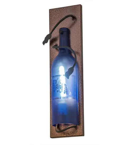 Capture the mood or life of any party with authentic wine bottle lighting. This wall fixture does so much more than deliver light, it adds personality and pizazz to any interior. A hand forged Black vine and leaf coil is designed around the neck of this stunning Blue Glass wine bottle, which illuminates and features a stunning etched Grape design. The sconce is complemented with handsome hardware featured in a Copper Vein finish. Perfect for homes, restaurants, hotels, pubs, nightclubs, wineries, and retailers, this sconce is handmade by Meyda artisans in our manufacturing facilities in upstate New York. Custom colors, styles, sizes and dimmable energy efficient lamping options. UL and cUL listed for damp and dry locations. Collection: Tuscan Vineyard Finish: Copper Metallic / Black Cherry Glass: Blue Sandblasted Width: 4.50" Height: 15.00" Length: 2.50" Weight: 2.00 lb Extension from Wall: 2.50" Number of Bulbs: 1 Maximum Wattage: 40.00 W Bulb Type: T6.5 Bulb Base: E17 Material: Metal Country of Origin: USA Safety Listing: Damp Safety Rating: Damp - alternate view
