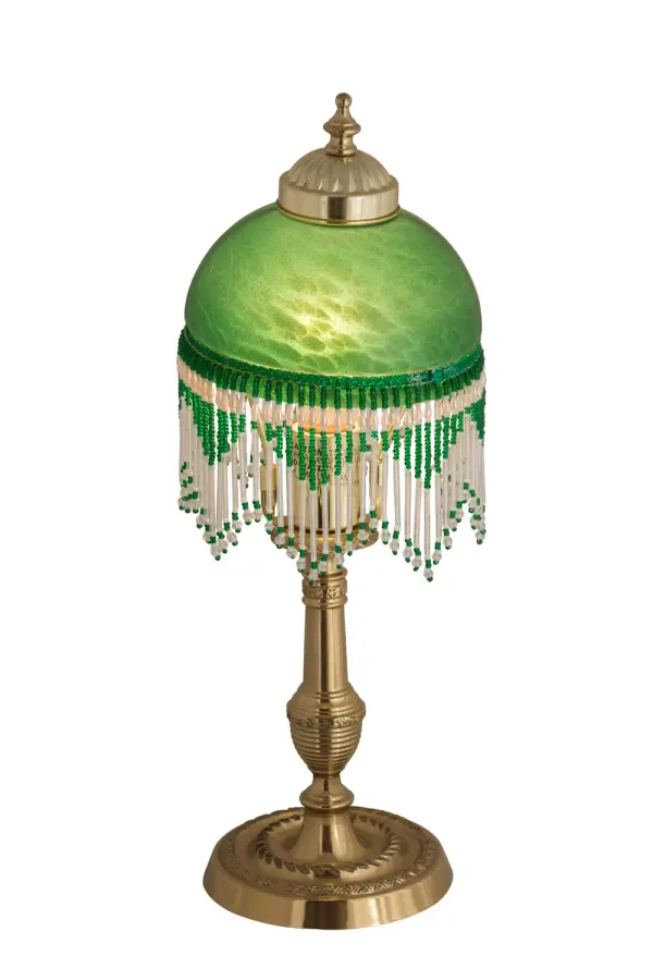 A charming nostalgic accent lamp. This Roussillon Lamp features a stunning Green Mottled Glass shade that is color coordinated with delicate White and Green glass beaded fringe. This Victorian-inspired, intricately detailed shade is combined with a beautifully detailed lamp base in a Brass plated finish. Collection: Roussillon Finish: Polished Brass Glass: Green Width: 5.25" Height: 17.00" Length: 5.25" Weight: 2.50 lb Number of Bulbs: 1 Maximum Wattage: 60.00 W Bulb Type: A19 Bulb Base: E26 Material: Brass Country of Origin: CHINA Safety Listing: Dry Safety Rating: Dry