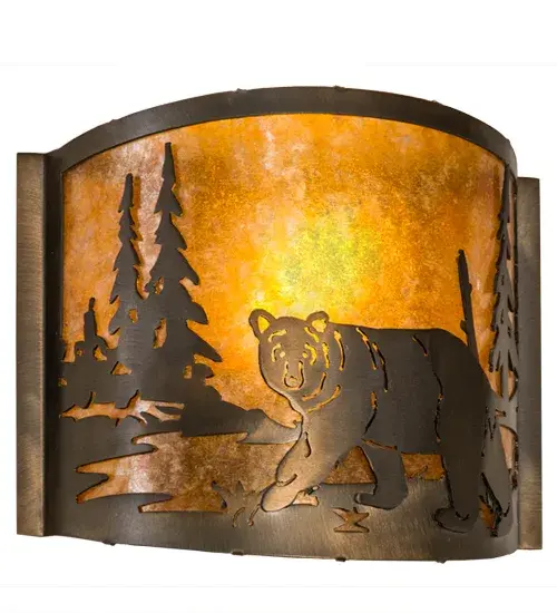 Drawing inspiration from the wildlife and natural beauty in the spectacular American mountain ranges- from New York's Adirondacks; to Big Bend National Park in Texas; to Mount Ranier in Washington. This stunning wall fixture depicts a bold Bear meandering through the woodlands. An Amber Mica shade features an Antique Copper finish and will bring the splendor of the wildlife into your home. Ideal for illuminating walls in corridors and dining areas in residential and hospitality settings. The Lone Bear Wall Sconce is included in our American-made; American-designed; handcrafted Wildlife Collection and manufactured in Yorkville; New York. UL and cUL listed for dry and damp locations. - alternate view