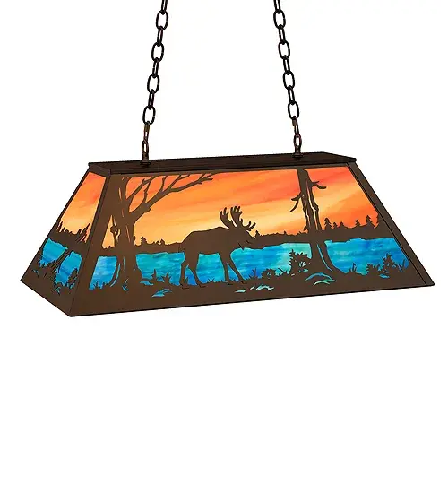 The majestic Moose meanders near the woodland lake in this nature-inspired pendant design. The fixture features an Orange Sky and a Blue-Green lake in beautiful art glass. The pendant is enhanced with a Timeless Bronze finish. The oblong pendant is perfect for illuminating bars, islands, and tables in timber homes, lodges and other spaces from Traverse City, Michigan, to Lake Tahoe, Nevada, to Lake Geneva, Wisconsin. The overall height ranges from 18 to 43 inches as the chain easily adjusts in the field to meet your exact specifications. The Moose at Lake Oblong Pendant is included in our American-made, American-designed, handcrafted Wildlife Collection and manufactured in Yorkville, New York. The fixture is UL and cUL listed for dry and damp locations. Upstate New York's adventurous playland, known as the Adirondack Mountains, with its many breathtaking forests, lakes, and rivers, is the spiritual birthplace of Meyda and inspires our rustic-themed art glass collections. Collection: Moose At Lake Finish: Timeless Bronze Glass: Oa Eb Width: 17.00" Height: 18.00" Length: 33.00" Weight: 30.00 lb Number of Bulbs: 6 Maximum Wattage: 60.00 W Bulb Type: A19 Bulb Base: E26 Material: Steel Country of Origin: USA Safety Rating: Damp - alternate view