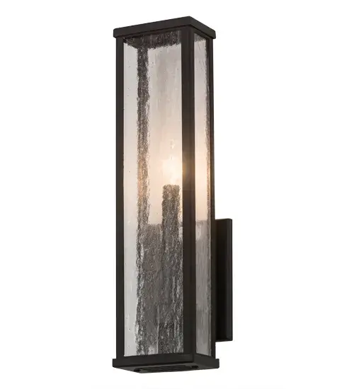 Rendering a mesmerizing architectural look; this lighting design features Clear Seeded glass which surrounds a Faux candlelight delivering beautiful ambient light. The frame is featured in a warm Wrought Iron finish. Wall sconce artistry is created by the hands of highly skilled artisans at our manufacturing facility in Upstate New York in the USA. Custom sizes; styles and colors are available; as well as dimmable; energy efficient lamping options such as LED. UL and cUL listed for dry; damp and wet locations. - alternate view