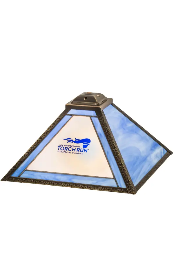 This attractive shade is personalized with the Torch Run Special Olympics and graphics featured on Blue and White Art Glass with a Craftsman Brown finished frame. The shade matches well with a base to create a stunning table lamp or hardware to build a ceiling fixture. The Personalized Torch Run Shade is included in our American-made; American-designed; handcrafted Personalized Collection and manufactured in Yorkville; New York. This personalized shade can be ordered by calling us and adding your business logo or family name for your next project. Please call for pricing and lead time.