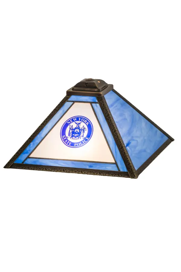 Designed as an award to recognize outstanding achievement; this stunning table lamp is personalized with the logo and name of the New York State Police. The trim is featured in Blue art glass; while the forefront features Frosted glass; and the frame is enhanced with a Craftsman Brown finish. The shade pairs well with a base to create an appealing table lamp. The Personalized State Trooper Shade is featured in our Personalized Collection and is manufactured in Yorkville; New York. Contact us for more information on custom lighting fixtures and lamps. Please call for the price and lead time.