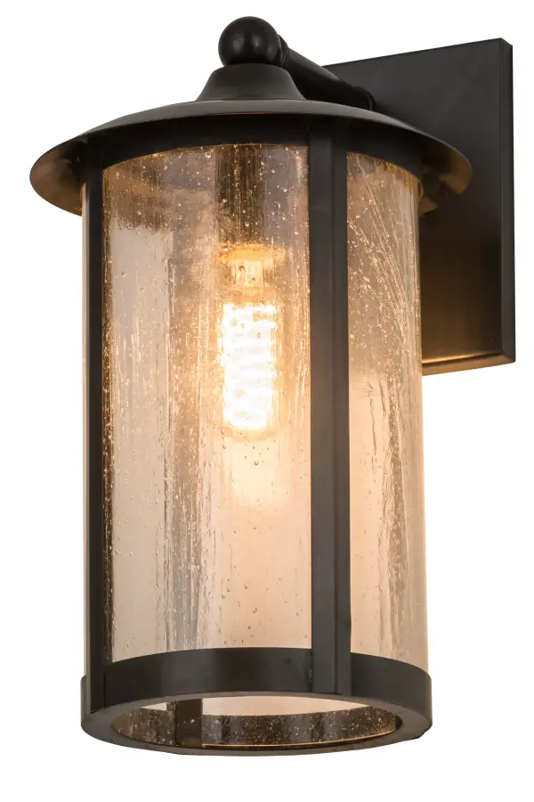 Handcrafted from Solid Brass with alluring rustic beauty. This stunning Craftsman Signature lantern features a Clear Seeded Glass lens enhanced with a Craftsman Brown finish. Display this wall sconce to illuminate the exterior of timber homes, modern farmhouses, and other spaces. The Fulton Prime Solid Mount Wall Sconce is included in our American-made, American-designed, handcrafted Craftsman Signature Series, manufactured in Yorkville, New York. UL and cUL listed for dry, damp, and wet locations. Our Build Your Own Craftsman Signature Series features unlimited combinations of styles. The collection is called Build Your Own because it is fully configurable and customizable from size and design to finish and lens color. Marine grade, solid brass, or copper raw materials are utilized to ensure items from the Craftsman Signature Series of outdoor and indoor lighting will stand the test of time, as these premium metals are impervious to most types of oxidation. Hand-applied Patina finishes on brass and copper are sealed with a clear varnish and over time, may require gentle maintenance, such as wax, to delay or reverse the natural living finish attributes indicative of this finishing process. Patina finishes on brass and copper provide strong resistance to fading from sun exposure, will not chip or crack, and will not rust like a steel-framed item in the same conditions. Choose from many style options, or send us your concept today! Call today to learn how to use the configuration tool available on our website for an instant item number! Collection: Fulton Finish: Craftsman Brown Glass: Clear Seeded Glass Width: 8.00" Height: 13.00" Length: 8.50" Weight: 4.50 lb Extension from Wall: 8.50" Number of Bulbs: 2 Maximum Wattage: 60.00 W Bulb Type: A19 Bulb Base: Medium Material: Brass Country of Origin: USA Safety Listing: Wet Safety Rating: Wet