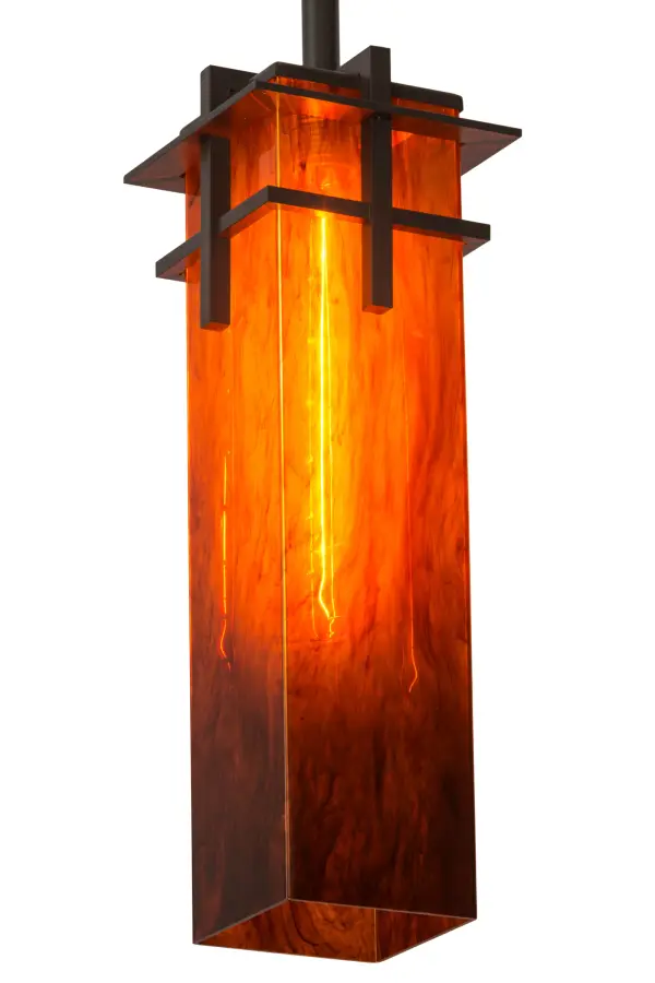 Craftsman minimalist styling is updated with a stunning modern look. Quadrato Firebird brandishes a column shaped Maduro Idalight diffuser featuring artful glass-like streaks and a unique textured look while evoking beautiful ambient illumination. The striking diffuser is paired with a traversed metal motif featured in a Timeless Bronze finish to match the hardware. Handcrafted by highly skilled artisans in our manufacturing facility in Upstate New York; this pendant is available in a wide range of custom choices including various designs; colors; sizes and dimmable energy efficient lamping options such as LED. The 55-inch tall fixture is UL and cUL listed for damp and dry locations.