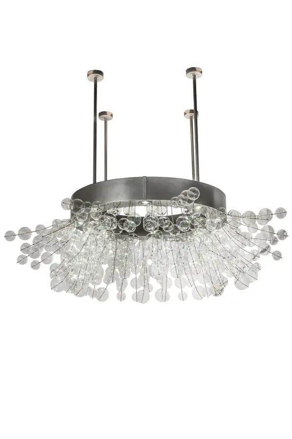 An effervescence of illumination shines brilliantly through this dazzling, exquisite column bracelet chandelier which was inspired by a Rhododendron bush. Perfect for installation around a large column, this grand-styled 90-inch fixture highlights dozens of Clear Glass orbed accents. The orbs illuminate with 8 customer supplied, Medium based LED 12-watt downlights and extend out with branch-like rods embraced by the sturdy Nickel-finished ring. 8 Additional 5W LED lamps provide ambient uplighting. Handcrafted in our 180,000 square foot manufacturing facility in Yorkville, New York. This fixture is available in custom sizes, styles and finishes, as well as dimmable lamping options. UL and cUL listed for dry and damp locations. Collection: Rhododendron Finish: Nickel Glass: Clear Width: 90.00" Height: 60.00" Length: 90.00" Weight: 30.00 lb Number of Bulbs: 8 Maximum Wattage: 5.00 W Bulb Type: MR16 Bulb Base: E26 Material: Steel Country of Origin: USA Safety Listing: Damp Safety Rating: Damp