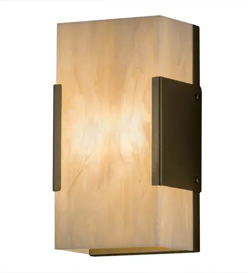 Rendering a mesmerizing architectural look, this stunning lighting design features Creme Carrere Idalight which delivers beautiful ambient light. The gorgeous diffuser is embraced with a bookend styled frame featured in a Gold Metallic finish. Wall sconce artistry is created by the hands of highly skilled artisans at our 180,000 square foot manufacturing facility in Yorkville, New York. Custom colors, styles and sizes are available, as well as dimmable energy efficient lamping options such as LED. The 9.5-inch tall ADA compliant wall luminaire is UL and cUL listed for damp and dry locations. Collection: Quadrato Finish: Gold Metallic Glass: Creme Carrare Idalight Width: 5.25" Height: 9.50" Length: 3.50" Weight: 2.50 lb Extension from Wall: 3.50" Number of Bulbs: 2 Maximum Wattage: 5.00 W Bulb Type: B10 Bulb Base: E12 Light Source: LED Material: Steel Country of Origin: USA Safety Listing: Damp Safety Rating: Damp LED - alternate view