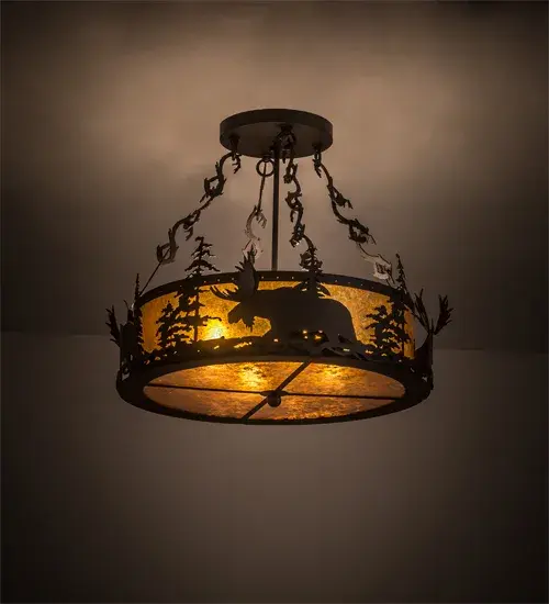 A majestic Moose wanders through the tall Pine trees around the perimeter of this dramatic ceiling fixture. This striking semi flushmount is featured with Pine Branch accents on chains and rim in an Oil Rubbed Bronze finish. A stunning Amber Mica shade with a matching bottom diffuser provide beautiful ambient lighting. The Moose at Dusk fixture is Domestically Produced in the USA at our Yorkville; NY manufacturing facility. Customize lens colors; metal finishes and fixture sizes. UL and cUL listed for dry and damp locations.