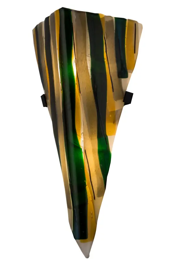 American craftsmanship is combined with European artistry which results in this striking lighting design. A cool decorative lighting style is achieved by kiln firing fused glass into this unique wall sconce. The Metro Fusion Fettuccine shade is complemented with Solid Iron hardware featured in a Textured Black finish. Custom styles; colors and sizes are available; as well as dimmable energy efficient lamping options such as LED. This sconce is UL and cUL listed for damp and dry locations.