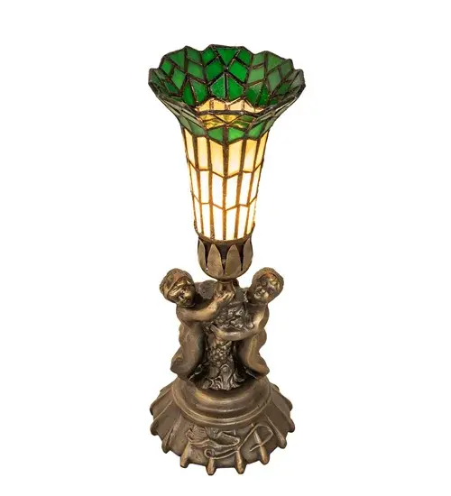 Inspired by the famous Tiffany design from the early 1900s. This mini lamp features a stunning shade mouth blown of fine Beige and Green art glass. The Pond Lily shade is embraced by an elegant cast base featuring two cherubs finished by hand in Antique Brass. The Pond Lily Table Lamp is featured in our American-designed, handcrafted Stained Glass Lighting Collection. UL and cUL listed for dry locations. Each shade is a unique work of art with color variations based on natural ingredients inherent in the glass. Contact us if color matching is critical when ordering multiple items. Collection: Stained Glass Pond Lily Finish: Antique Brass Glass: Honey Wispy/Kelly Green Width: 5.00" Height: 13.00" Length: 5.00" Weight: 2.00 lb Number of Bulbs: 1 Maximum Wattage: 60.00 W Bulb Type: B10 Bulb Base: E12 Material: Zinc Country of Origin: CHINA Safety Listing: Dry Safety Rating: Dry - alternate view