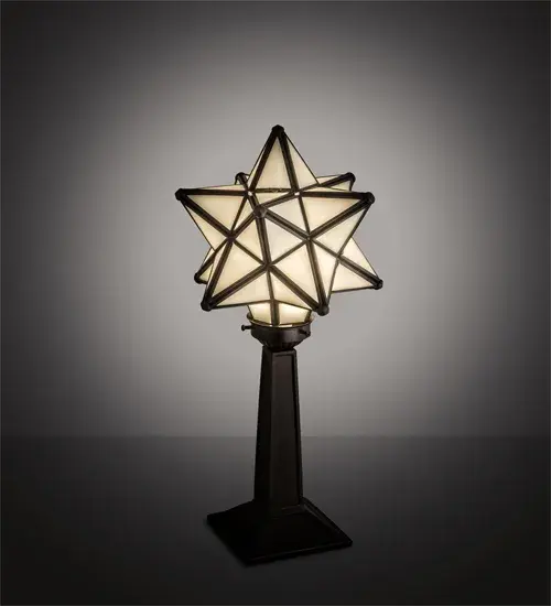 Like wishing upon a magical star... Grace your home with this timeless accent lamp. Dating back hundreds of years in Europe; the Star was used to protect homes and bring good luck to families. This unique lamp features a Star-styled White Art Glass shade; which is created with a dozen points of light. The stunning shade is crafted using the famous Meyda Tiffany Brass Channel Construction technique and is complemented by a Mahogany Bronze finished base. The lamp is ideal for illuminating a picture window; credenza; or desk. The Moravian Star Accent Lamp is part of our American-designed; handcrafted Moravian Star Collection. The fixture is UL and cUL listed for dry locations.