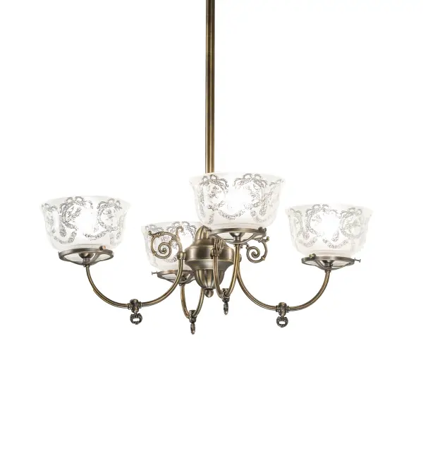 Inspired by lighting fixtures that were powered with both gas and electricity during a transitional period. Today this classic chandelier features four shades which reveal a lovely Wreath and Garland pattern in Frosted and Clear glass. Handcrafted of Solid Brass in our 180;000 square foot manufacturing facility in Yorkville; NY. Shade colors; metal finishes and fixture sizes can be customized. This fixture is UL and cUL listed for damp and dry locations.