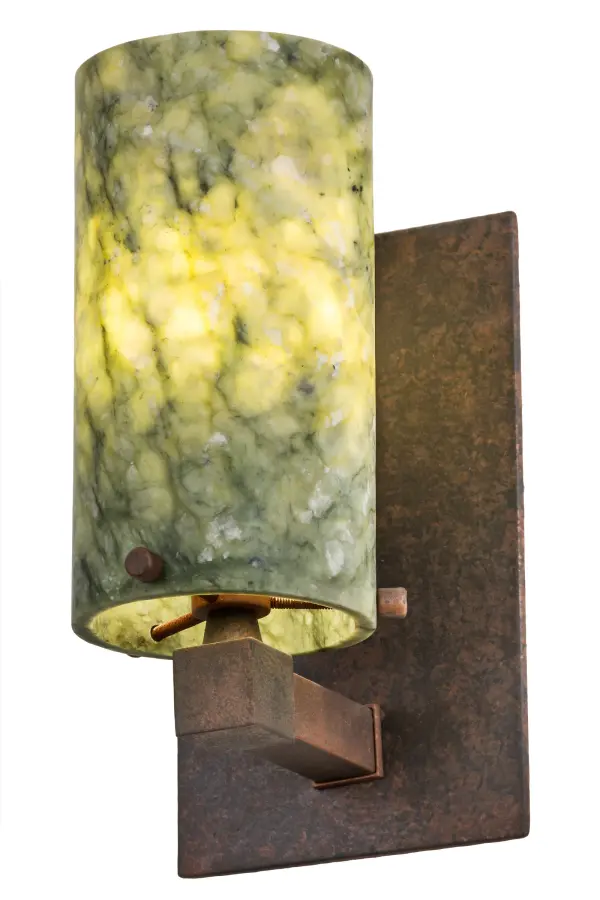 Inspired by nature. This exquisite organic pendant features tones of hand polished Dark Green Jadestone that adds a look of calm serenity with the natural marble patterning. Paired with a Rusty Nail hardware. Handcrafted in our 180,000 square foot manufacturing facility in Yorkville, New York. Shade colors, metal finishes and fixture sizes can be customized to your needs. UL and cUL listed for dry and damp locations. Collection: Cilindro Finish: Rusty Nail Glass: Dark Green Jadestone Width: 4.50" Height: 8.50" Length: 5.50" Weight: 3.50 lb Extension from Wall: 5.50" Number of Bulbs: 1 Maximum Wattage: 60.00 W Bulb Type: BA10 Bulb Base: E26 Material: Metal Country of Origin: USA Safety Listing: Damp Safety Rating: Damp