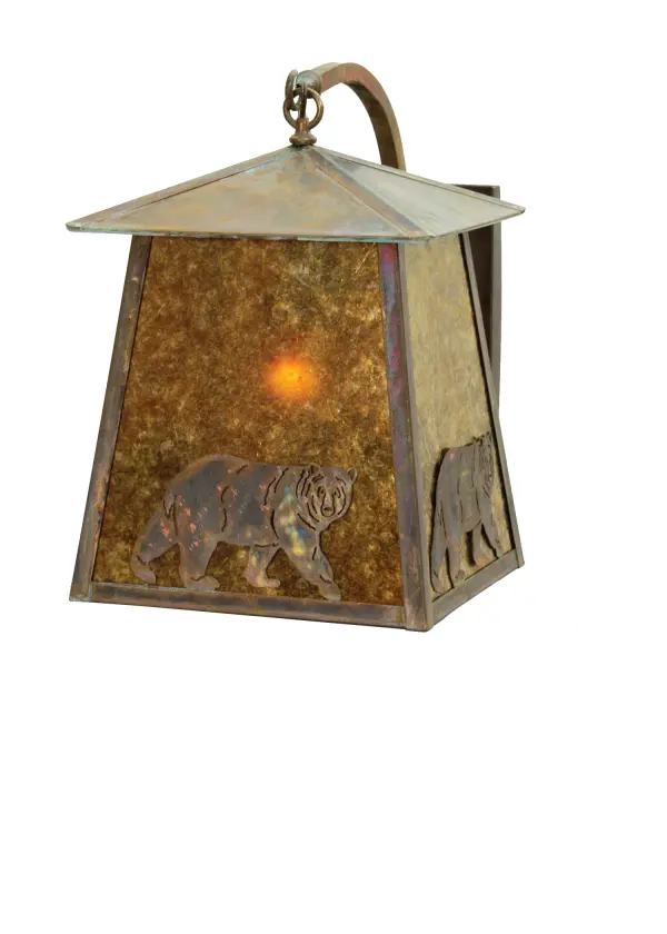A North Woods Bear is depicted on this handsome American Craftsman lantern style curved arm wall sconce. The fixture; handcrafted in the USA by Meyda artisans; is finished in Vintage Copper and has Amber mica panels.