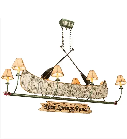 This handsome 8-light chandelier; complete with Antique Copper finished steel paddles; is the perfect complement to your camp; home; lodge or cabin. Rock Springs Ranch is custom engraved with a hot iron branding on the attached signage. This charming fixture features a faux birch bark Canoe; surrounded by eight curved arms with Parchment shades that top Ivory faux candlelights on bobeches. The hardware includes Tarnished Copper finished arms and frame. The chandelier is ideal for your home. Call us for illuminating a tiki party; bar; island; counter; or table. The overall height ranges from 44 to 164 inches; as the chain length can be easily adjusted in the field to accommodate your specific lighting application needs. This luxurious fixture is perfect for illuminating bars; dining tables; lobbies; entryways; and other residential; hospitality; and commercial spaces throughout the U.S.; including Greenville; Maine; Wolfeboro; New Hampshire; and Lake Havasu City; Arizona. The Personalized Canoe 8 Light Chandelier is featured in our American-made; American-designed; handcrafted Personalized Lighting Collection. UL and cUL listed for dry and damp locations; however; we do not recommend placing it in spaces that experience a large amount of moisture due to the fabric shades. Please provide us with your family name so we can develop lighting fixtures that bring joy and pride; pricing; and lead time. - alternate view