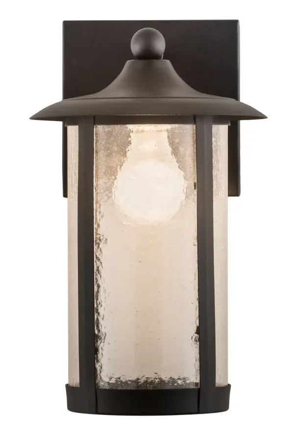 Handcrafted from Solid Brass with alluring rustic beauty. This stunning Craftsman Signature lantern features a Clear Seeded Glass lens enhanced with an Old Wrought. Iron finish. This wall sconce is perfect for illuminating hallways or covered porches of timber homes, modern farmhouses, and other spaces. The Fulton Prime Solid Mount Wall Sconce is included in our American-made, American-designed, handcrafted Craftsman Signature Series, manufactured in Yorkville, New York. UL and cUL listed for dry and damp locations. Our Build Your Own Craftsman Signature Series features unlimited combinations of styles. The collection is called Build Your Own because it is fully configurable and customizable from size and design to finish and lens color. Marine grade, solid brass, or copper raw materials are utilized to ensure items from the Craftsman Signature Series of outdoor and indoor lighting will stand the test of time, as these premium metals are impervious to most types of oxidation. Hand-applied Patina finishes on brass and copper are sealed with a clear varnish and over time, may require gentle maintenance, such as wax, to delay or reverse the natural living finish attributes indicative of this finishing process. Patina finishes on brass and copper provide strong resistance to fading from sun exposure, will not chip or crack, and will not rust like a steel-framed item in the same conditions. Choose from many style options, or send us your concept today! Call today to learn how to use the configuration tool available on our website for an instant item number! Collection: Fulton Finish: Old Wrought Iron Glass: Clear Seeded Glass Width: 8.00" Height: 12.50" Length: 8.00" Weight: 2.50 lb Extension from Wall: 8.00" Number of Bulbs: 1 Maximum Wattage: 60.00 W Bulb Type: A19 Bulb Base: E26 Material: Brass Country of Origin: USA Safety Listing: Damp Safety Rating: Damp