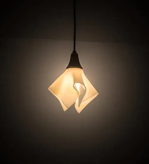 American craftsmanship is combined with European artistry which results in chic lighting pendant. A cool decorative design is achieved by kiln firing glass into a unique draped glass pendant. This Ivory handkerchief styled Art Glass shade is complemented with Solid Brass hardware in a Craftsman Brown finish. Illuminate a table with this mini pendant or align the pendant in multiples across an island; bar; table or counter in residential and commercial settings. Custom styles; colors and sizes are available; as well as dimmable energy efficient lamping options such as LED. This 10-inch wide pendant is UL and cUL listed for damp and dry locations.