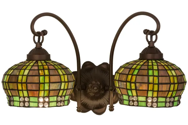 Like a beautiful little basket lantern; this charming globe shaped shade of Amber Mauve and Bronzed Green edged art glass in Clear glass jewels; is suspended from the arm of a wall sconce. The hand crafted Tiffany style shades; created using Meyda's famous copperfoil construction process; is complemented by the hardware which is hand finished in Mahogany Bronze. Custom sizes; styles; colors and dimmable energy efficient lamping options are available.