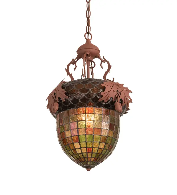 Majestic as the mighty oak is this leaf-adorned inverted pendant. A lighted art glass Acorn in Multicolored Autumn colors features a Bark Brown Granite Glass crown sprouting metal Oak Leaves. The stunning shade is complemented with a stunning Rust finish. It is ideal for placement in living rooms, lobbies, entryways, and hallways in residential and hospital settings. The ceiling pendant is inspired by Oak forests from Hampton, Virginia, to New Orleans City Park, Louisiana, to Jurupa Valley, California. The overall height of this beautiful pendant ranges from 26 to 169 inches, as the chain length can be easily adjusted in the field to accommodate your specific lighting application needs. The Oak Leaf & Acorn Pendant is included in our American-made, American-designed, handcrafted Nature Inspired Stained Glass Lighting Collection and is manufactured in Yorkville, New York. UL and cUL listed for dry and damp locations. Collection: Oak Leaf & Acorn Finish: Rust Glass: Stained Glass Width: 15.00" Height: 26.00" Length: 15.00" Weight: 11.50 lb Number of Bulbs: 1 Maximum Wattage: 60.00 W Bulb Type: A19 Bulb Base: E26 Material: Steel Country of Origin: USA Safety Listing: Damp Safety Rating: Damp