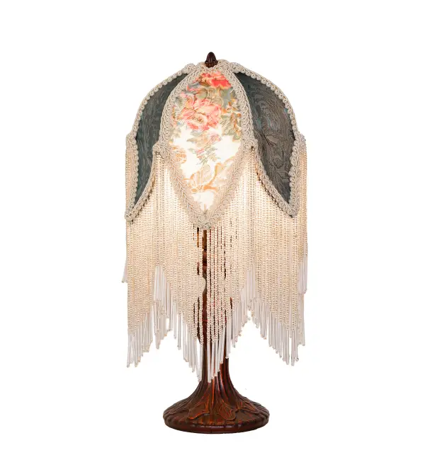 Hunter Green; Ivory; and Pink floral damask fabrics are accented with a Warm Ivory Trim; which is edged in long White Glass beaded trim. This Victorian-inspired; intricately detailed shade is combined with a beautifully detailed cast metal lamp base in a hand-applied Mahogany Bronze finish. The lamp is ideal as a lighted accent piece on a living room end table; dining room credenza; or bedroom nightstand. This lighting design is inspired by beautiful fabrics and fashion from New York; to Chicago; Illinois; and Los Angeles; California. The Fabric & Fringe Roses Accent Lamp is featured in our American-made; handcrafted Fabric & Fringe Collection. UL and cUL listed for dry locations.