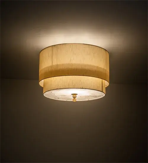 A unique architecturally designed ceiling fixture. Cilindro Lujoso features two Natural Wafer Silk shades with a Statuario Idalight top diffuser and a Yuma Idalight bottom diffuser. The finial is featured in in Brass and Gold powder coat finishes. Handmade by highly skilled artisans in our 180;000 square foot manufacturing facility in Yorkville; New York. Custom sizes; styles; and colors are available. UL and cUL listed for dry and damp locations however we do not recommend installing it in spaces that experience a large amount of moisture due to the fabric shades.