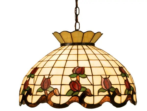 Grace your home with this elegant crowned shade, featuring a gridwork of Bone Beige glass, adorned with a Rootbeer granite border of swirling ribbons and perfect Burgundy rosebuds. The Tiffany style stained glass pendant is made of hand cut and copperfoiled glass and is suspended from Mahogany Bronze, hand finished chain and canopy. Collection: Roseborder Finish: Mahogany Bronze Glass: Ba Br 59 Xag Width: 20.00" Height: 15.00" Length: 20.00" Weight: 10.00 lb Number of Bulbs: 3 Maximum Wattage: 60.00 W Bulb Type: A19 Bulb Base: Medium Material: Metal Or Polyresin Country of Origin: CHINA Safety Listing: Dry Safety Rating: Damp