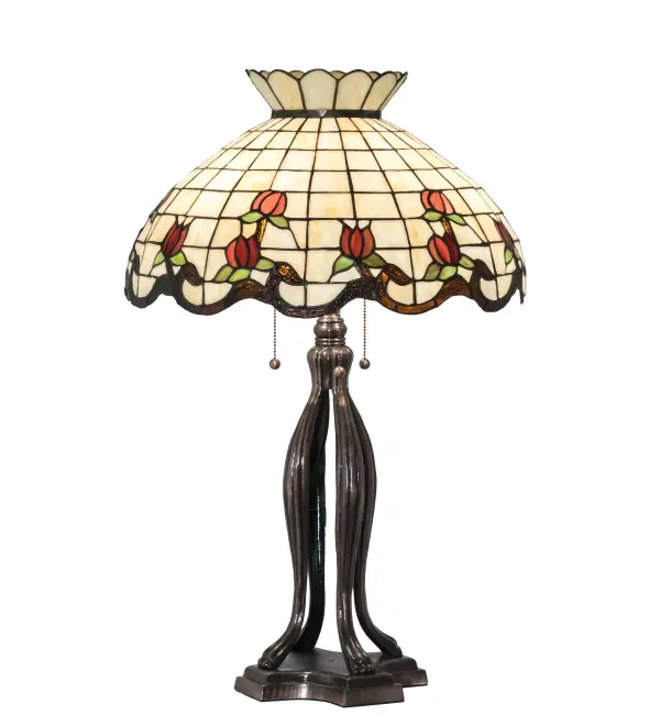 Grace your home with this elegant crowned shade; featuring a gridwork of Bone Beige glass; adorned with a Rootbeer granite border of swirling ribbons and perfect Burgundy rosebuds. The Tiffany style stained table lamp is made of hand cut and copperfoiled glass and is paired with a Mahogany Bronze; hand finished lamp base.