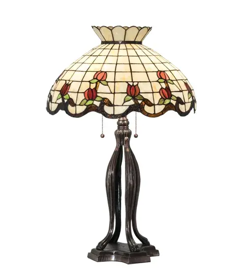 Grace your home with this elegant crowned shade; featuring a gridwork of Bone Beige glass; adorned with a Rootbeer granite border of swirling ribbons and perfect Burgundy rosebuds. The Tiffany style stained table lamp is made of hand cut and copperfoiled glass and is paired with a Mahogany Bronze; hand finished lamp base. - alternate view
