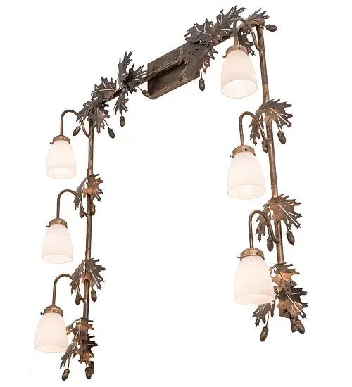 Drawing inspiration from the Mighty Oak; this unique Vanity Light is custom designed to outline a mirror in a fine bath or other rooms. The wall fixture embraces 6 White Opal Goblet styled shades to deliver functional downlighting which is complemented with a Dark Burnished Antique Copper finished Oak Leaf and Acorn accents and frame. Custom crafted in our 180;000 square foot manufacturing facility at the foothills of the Adirondack Mountains in Upstate NY; this wall fixture is available in custom styles; sizes; and colors; and with dimmable energy efficient lamping options such as LED. This 36-inch wide luminaire is UL and cUL listed for dry and damp locations. - alternate view