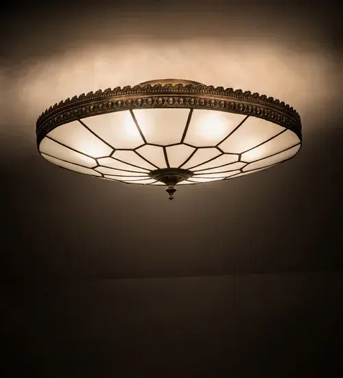 Embrace the timeless look of this classic art glass lighting design. The Vincent Honeycomb ceiling fixture features a Clear Frosted hand-curved art glass shade with a Honeycomb pattern. The shade is enhanced with Brass filigree accents finished in an antique brass finish. The Quality Bent Glass division of Meyda is over 100 years in the making. Today we are still creating timeless masterpieces using tools and methods from the days when we supplied Tiffany Studios. Glass colors and metal finishes are customizable as each Tiffany Bent Panel fixture is handcrafted to order. Handmade in our 180;000 sq ft manufacturing facility Yorkville; New York. UL & cUL listed for dry and damp locations.
