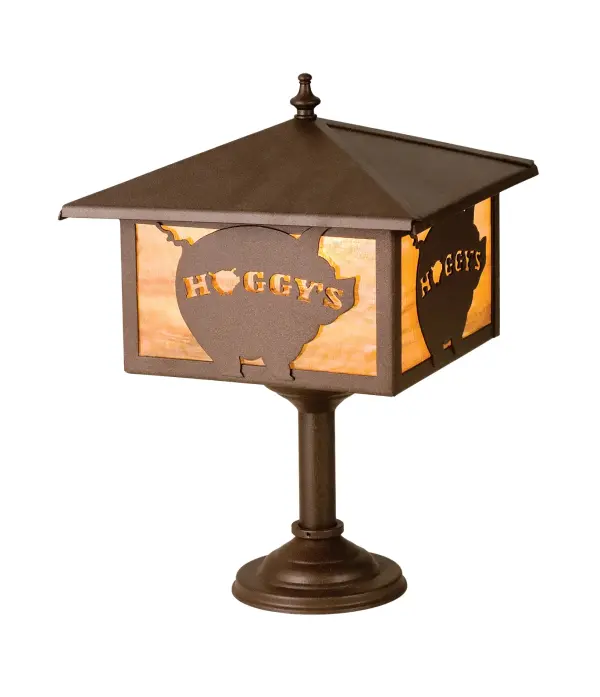 With their Logo emblazoned on a chubby pig; this custom mission lantern bar mount fixture is handcrafted in the USA by Meyda artisans. This handsome fixture is finished in Cafe Noir and has Honey art glass panels. This personalized lamp is shown as an example of our craftsmanship and custom capabilities. It is not for sale as is; but can be customized to fit your personal needs with your family name or business logo.