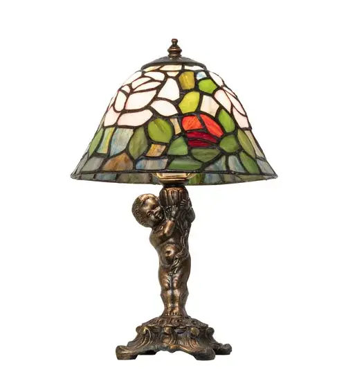 The most beloved of all floral beauties. The Rosebush is beautifully represented in this stunning reproduction of a Tiffany Studio Classic. Petal Pink; Romantic Red; and Beautiful Blue art glass Roses ramble on a maze of Garden Green leaves. The luxurious shade is created using the famous Meyda Tiffany copperfoil construction and paired with an elegant cast metal base featuring a Cherub finished in Mahogany Bronze. The lamp is ideal for placement in picture windows and on tables and desks in homes and offices. The Tiffany Rosebush Cherub Accent Lamp is included in our American-designed; handcrafted Tiffany Reproduction Collection. UL & cUL listed for dry locations. Each shade is a unique work of art with color variations based on natural ingredients inherent in the glass. - alternate view