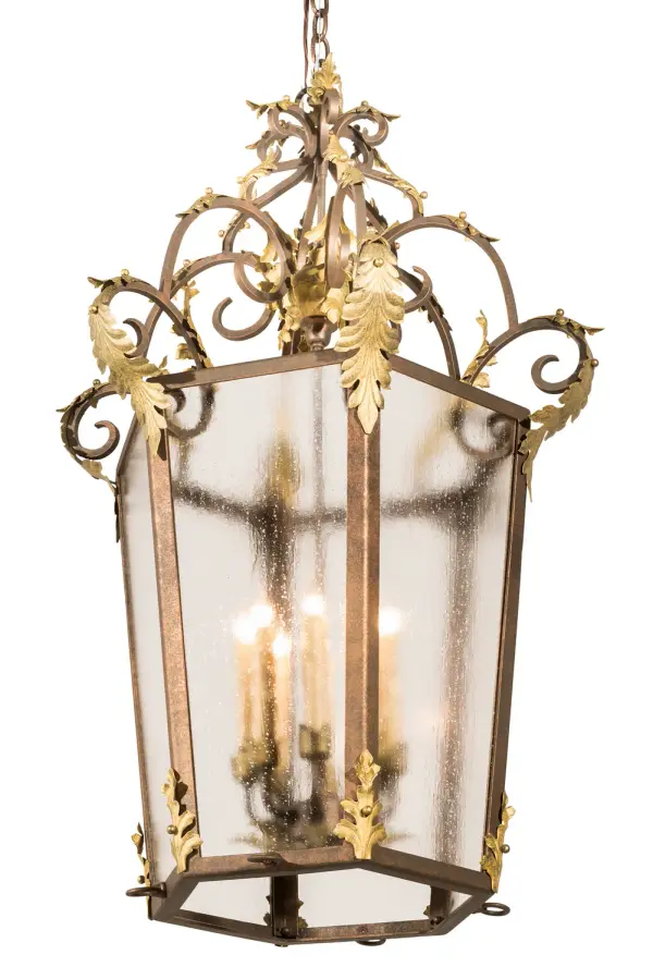 Utilizing a blend of timeless craftsmanship and classic design, the Elisa brings home unsurpassed quality and shapely appeal. Evoking a dramatic effect, beautiful ambient light is projected through a Rainstone Idalight diffuser which reveals 8 Amber faux candlelights featured within. The pendant is enhanced with HandForged Scrollwork, frame and hardware featured in a Light Tobacco finish with Antique Gold Acanthus Leaf accents. The overall height of this pendant ranges from 43 to 115 inches as the chain length can be easily adjusted in the field to accommodate your specific lighting application needs. The fixture is handcrafted in our 180,000 square foot manufacturing facility in Yorkville, NY. Custom options available. UL and cUL listed. Collection: Elisa Finish: Light Tobacco & Antique Gold Glass: Rainstone Idalight Width: 25.00" Height: 43.00" Length: 25.00" Weight: 45.00 lb Number of Bulbs: 8 Maximum Wattage: 60.00 W Bulb Type: BA9 Bulb Base: E12 Material: Steel Country of Origin: USA Safety Listing: Damp Safety Rating: Damp