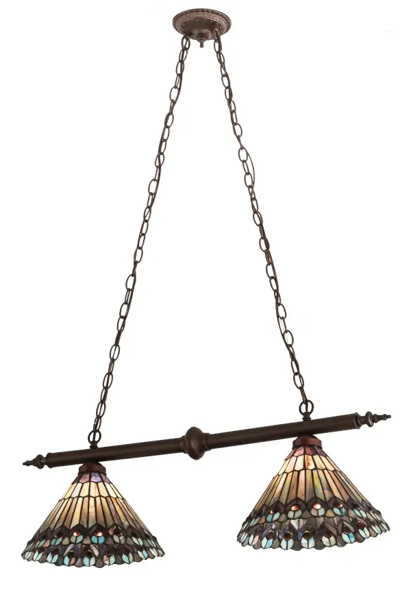 As distinctive as beautiful Peacock fanning feathers in the wild; no two shades will ever be the same. Their individuality can be as remarkably unique as their personality in this two-light pendant. This artistic creation uses art glass background combinations; including Beige; Yellow Pinks; Golden Greens; Ivory; Bluish Whites; Turquoise Blues; Olive; and Spring Greens. The eye of the plumage design reveals Purples; Pastel Blues; Teals; Cobalt; and Ivory; accented with Blue- and Purple- colored jewels. Three exquisite stained-glass shades are crafted using the renowned Meyda Tiffany copper-foil construction technique. The fixture is ideal for illuminating bars; islands; and tables and is enhanced with scrollwork and hardware in a Tarnished Copper finish. The Tiffany Jeweled Peacock 2 Light Island Pendant is featured in our American-designed; handcrafted Tiffany Reproduction Collection. UL and cUL listed for dry and damp locations. Each shade is a unique work of art; with color variations reflecting the natural ingredients inherent in the glass.