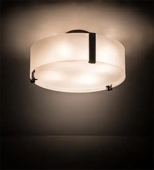 This stunning lighting fixture seamlessly blends a modern aesthetic with a minimalist design. The ceiling fixture features an alluring Contrail Mist Idalight shade; complemented by a matching bottom diffuser. The fixture is enhanced with hardware and decorative accents in an Oil Rubbed Bronze finish. The fixture can illuminate a dining table or living area in homes; lounges; and restaurants. The Cilindro Flush Mount is part of our American-made; American-designed; handcrafted Modern Lighting Collection; which is manufactured in Yorkville; New York. The fixture is UL and cUL listed for dry and damp locations.