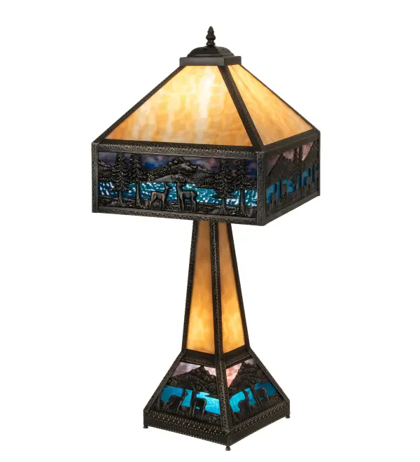 A magnificent table lamp to illuminate any interior decor. This Brass lamp features a Beige crown with a matching stem. The dramatic shade and matching base design feature Deer meandering near a Blue Green Ripple Glass lake below a Purple and Sky Blue art glass sky. Includes a 3-way switch to light the shade; base or both. Domestically Produced in our 180;000 square foot manufacturing facility in Yorkville; New York. Customize the shade colors; metal finishes and lamp sizes to meet your desires. UL and cUL listed for dry locations. The finish is Craftsman Brown.