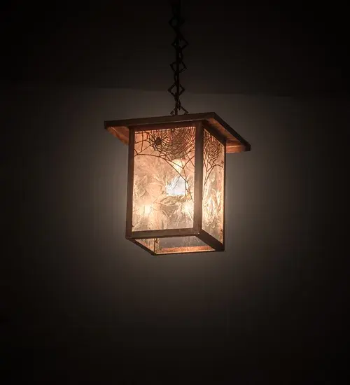 Crafted of Solid Copper; this Craftsman Signature pendant features the mystique and drama of a spider spinning its enchanting web as brilliant illumination shines in the background. The lens features Clear Leaf Glass; while the decorative accents; frame; and hardware are finished in a handsome Vintage Copper. The overall height ranges from 15 to 62 inches; as the chain can be easily adjusted on location. The Hyde Park Spider Web Pendant is included in our American made; American-designed; handcrafted Craftsman Signature Series is manufactured in Yorkville; New York. UL and cUL listed for dry and damp locations. Our Build-Your-Own Craftsman Signature Series offers unlimited style combinations. The collection is called Build Your Own because it is fully configurable and customizable from size and design to finish and lens color. Marine-grade solid brass or copper raw materials are used to ensure that items from the Craftsman Signature Series of outdoor and indoor lighting will stand the test of time; as these premium metals are impervious to most forms of oxidation. Hand-applied Patina finishes on brass and copper are sealed with a clear varnish and; over time; may require gentle maintenance; such as wax; to delay or reverse the natural living finish attributes indicative of this finishing process. Patina finishes on brass and copper provide strong resistance to fading from sun exposure; will not chip or crack; and will not rust like a steel-framed item in the same conditions. Choose from many style options; or send us your concept today! Please call today to learn how to use the configuration tool on our website to get an instant item number.