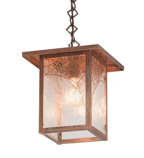 Crafted of Solid Copper; this Craftsman Signature pendant features the mystique and drama of a spider spinning its enchanting web as brilliant illumination shines in the background. The lens features Clear Leaf Glass; while the decorative accents; frame; and hardware are finished in a handsome Vintage Copper. The overall height ranges from 15 to 62 inches; as the chain can be easily adjusted on location. The Hyde Park Spider Web Pendant is included in our American made; American-designed; handcrafted Craftsman Signature Series is manufactured in Yorkville; New York. UL and cUL listed for dry and damp locations. Our Build-Your-Own Craftsman Signature Series offers unlimited style combinations. The collection is called Build Your Own because it is fully configurable and customizable from size and design to finish and lens color. Marine-grade solid brass or copper raw materials are used to ensure that items from the Craftsman Signature Series of outdoor and indoor lighting will stand the test of time; as these premium metals are impervious to most forms of oxidation. Hand-applied Patina finishes on brass and copper are sealed with a clear varnish and; over time; may require gentle maintenance; such as wax; to delay or reverse the natural living finish attributes indicative of this finishing process. Patina finishes on brass and copper provide strong resistance to fading from sun exposure; will not chip or crack; and will not rust like a steel-framed item in the same conditions. Choose from many style options; or send us your concept today! Please call today to learn how to use the configuration tool on our website to get an instant item number. - alternate view