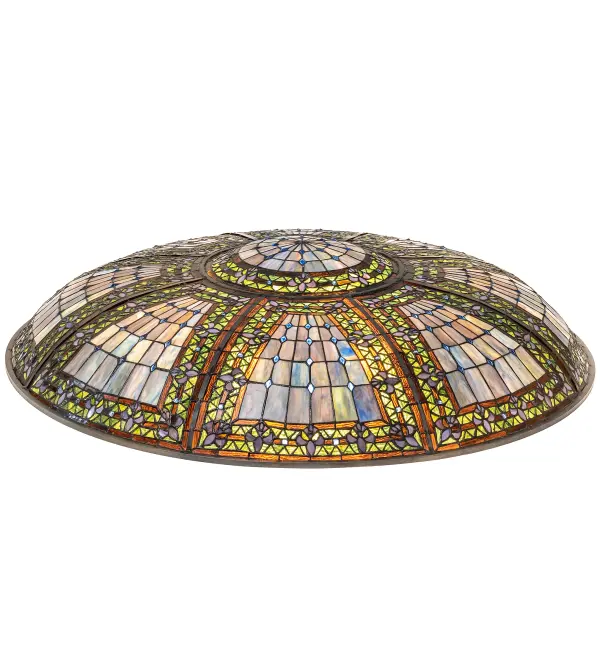 A Meyda original design inspired by castle and cathedral glass. This stained glass shade features purple tri-petaled irises and azure colored jewels against bands of green and umber; surrounding a mottled blue; mauve; and peridot field. The shade is created using the famous Meyda Tiffany copper foil construction process. It pairs with hardware to create pendants and other ceiling fixtures. The Fleur-de-lis Shade is included in our American designed; handcrafted Stained Glass Lighting Collection. Each shade is a unique work of art; featuring color variations derived from the glass's natural ingredients.