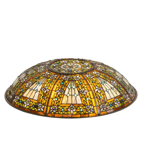 A Meyda original design inspired by castle and cathedral glass. This stained glass shade features purple tri petaled irises and azure colored jewels against bands of green and umber; surrounding a mottled blue; mauve; and peridot field. Created using the Meyda Tiffany copper foil construction process. Pairs with hardware to create pendants and other ceiling fixtures. Included in our American-designed; handcrafted Stained Glass Lighting Collection.
