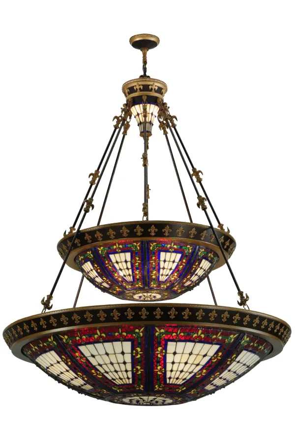 A Meyda Tiffany original design; the Fleur-de-Lis two tier inverted pendant is an intricate design of Yellow tri-petaled irises and Azure colored jewels against Crimson and Cobalt bands. Reminiscent of castle and cathedral glass; the fleur-de-lis pattern holds a prominent place in French Heraldry. Intricately detailed hardware; hand finished in Mahogany Bronze with Antique Gold accents; cradles a stained glass shade and lighted hub which are hand crafted utilizing the copperfoil construction process.