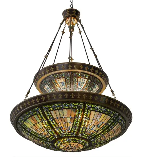 A Meyda Tiffany original design; this Grand Styled Fleur-de-lis 2-tier pendant features two art glass shades with an intricate design of Blue stylized tri-petaled lilies and matching glass jewels against bands of Twilight and Beige. Reminiscent of castle and cathedral glass; the Fleur-de-lis pattern holds a prominent place in European Heraldry. Intricately detailed hardware; hand finished in Mahogany Bronze; cradles stained glass shades which are hand crafted utilizing the famous Meyda copperfoil construction process. Custom options available. UL and cUL listed for damp and dry locations. - alternate view